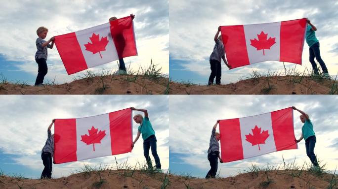 4k。夏天，金发男孩和女孩在蓝天上户外挥舞加拿大国旗 -- 加拿大日，国家，爱国主义，独立日7月1日