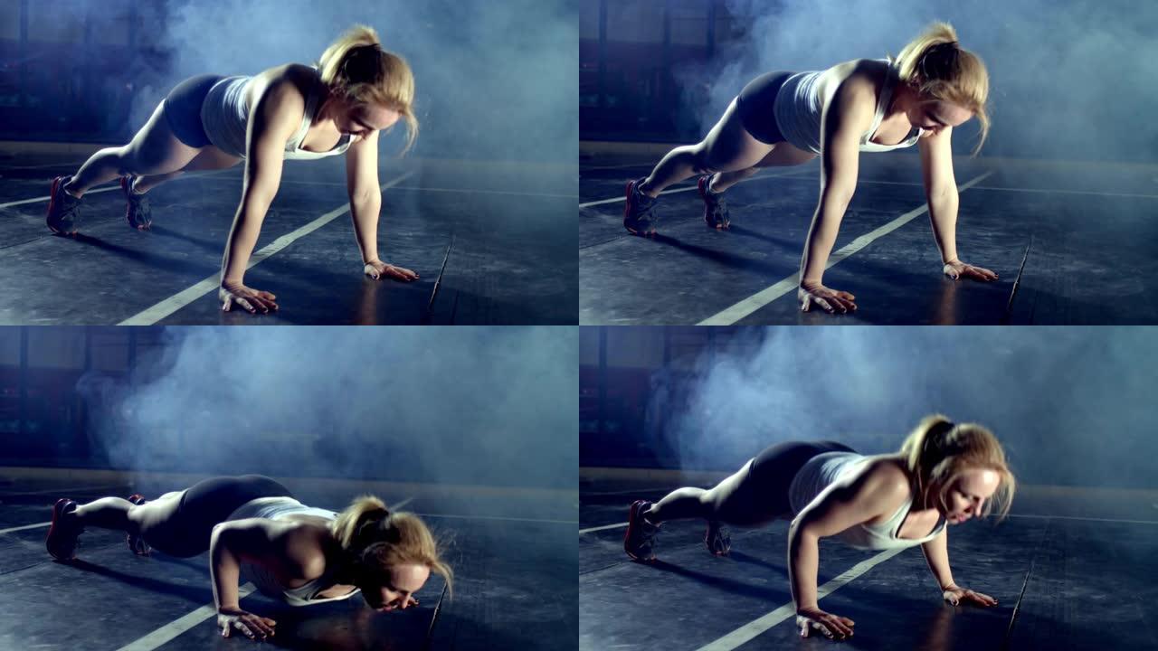 女人做全俯卧撑运动作为健身健美健身房训练