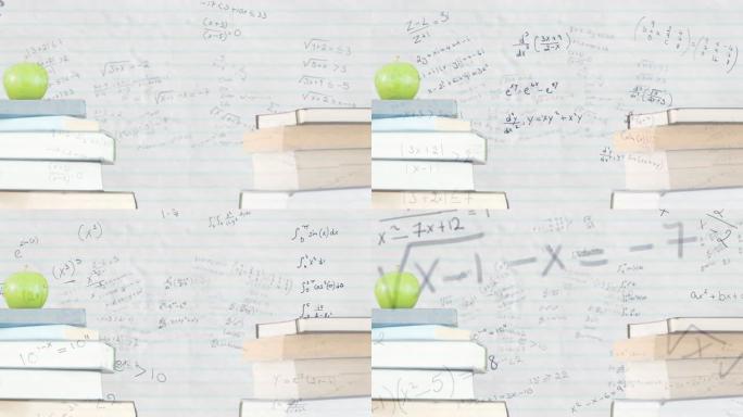 一堆书籍和苹果反对黑板上的数学方程式