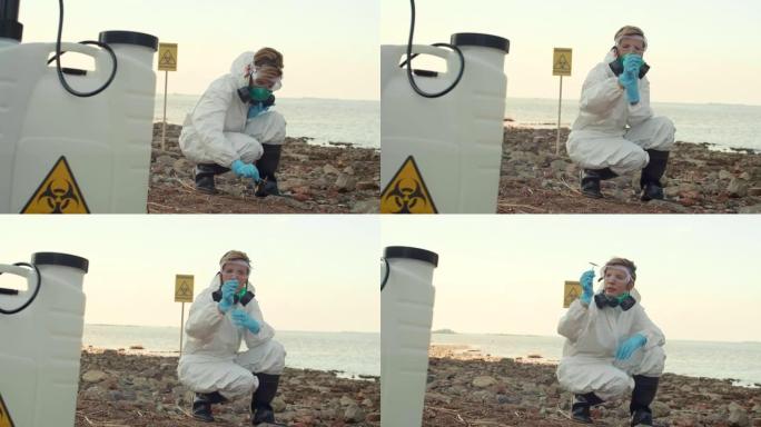 检查被污染的海岸的女科学家