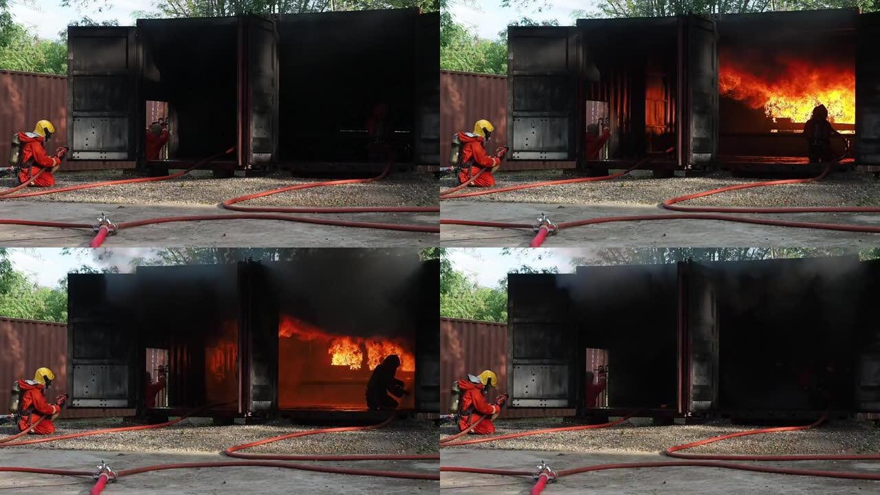 两名消防人员训练正在喷洒高压水灭火作业，