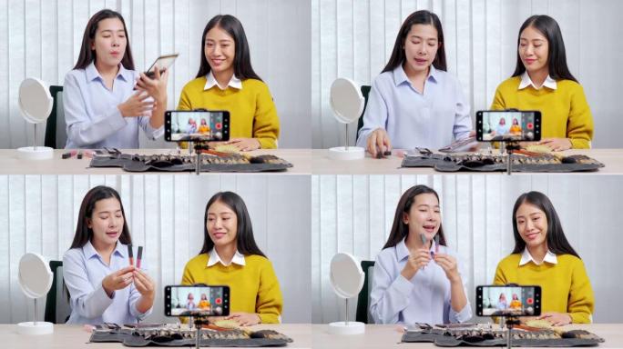 两名亚洲女性博客的4k视频片段录制vlog视频教程，并在社交媒体直播上评论推广带化妆化妆品的产品