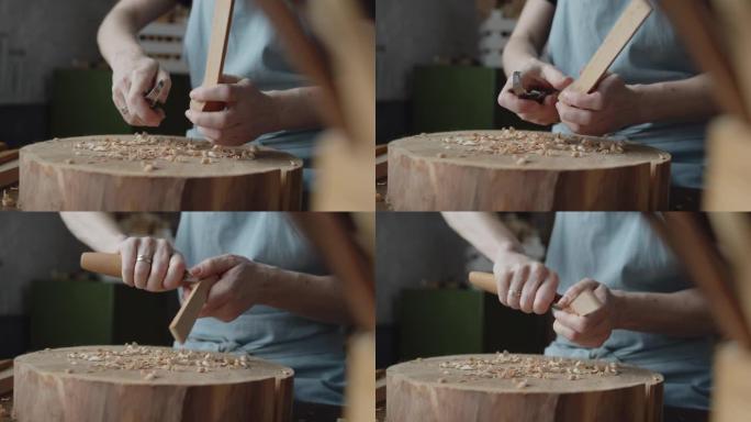 女木匠雕刻一块木头制作勺子特写