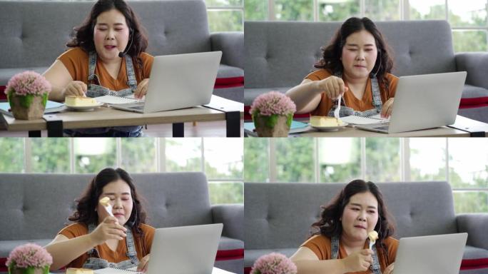 亚洲大型女性穿着休闲耳机，喜欢在家用笔记本电脑在线吃饭和工作，新的正常在线会议概念，4k倾斜拍摄