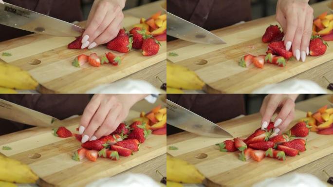 手女人在木板上切梨素食成分烹饪成熟水果板烹饪食物新鲜健康