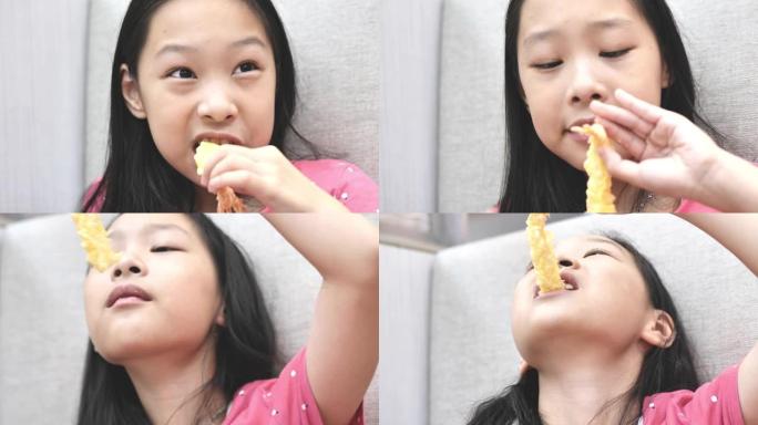 快乐的亚洲女孩在餐厅和家人一起吃日本料理，生活方式理念。