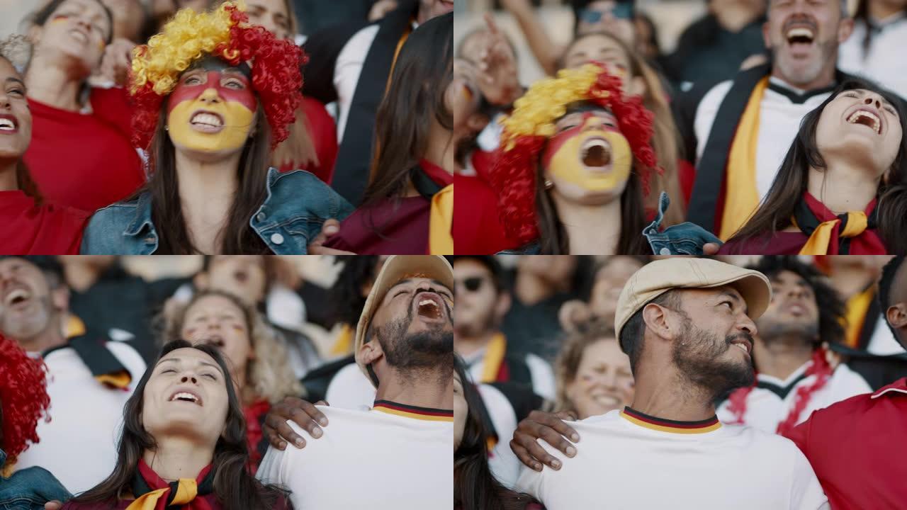 德国足球的支持者们在体育场里一起唱歌