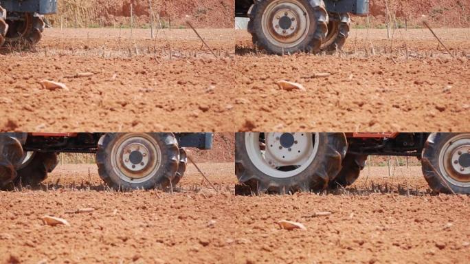拖拉机在尘土飞扬的干旱土壤中耕作，并为播种做好准备。有机农业。农业和农业综合企业