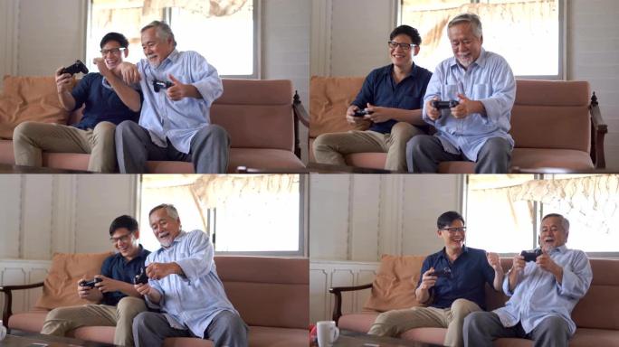 快乐的亚洲父子喜欢在家里的客厅用操纵杆玩电子游戏