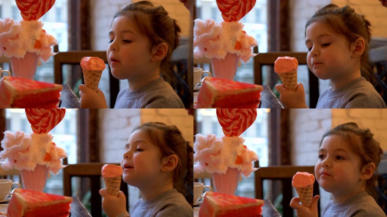 小女孩坐在咖啡馆的餐桌旁吃美味的冰淇淋