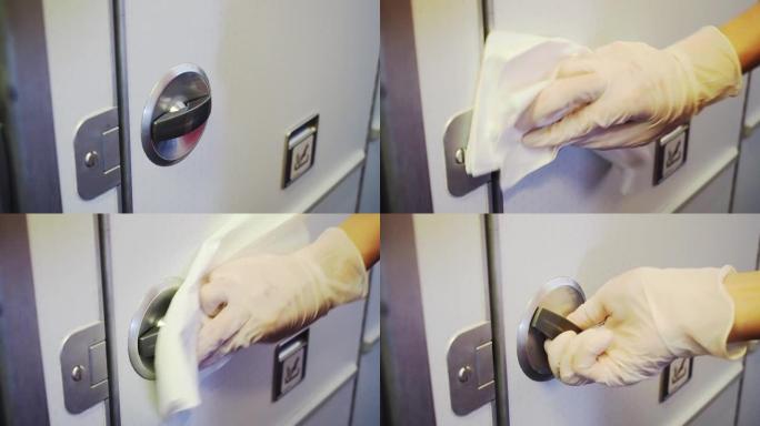 关闭女性手擦拭飞机盥洗室门把手，清洁习惯，飞机洗手间门上的细菌，电晕病毒covid19，公共卫生问题