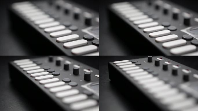 特写视频剪辑中的专业dj midi控制器设备。录音棚数字乐器上的白色按钮键。