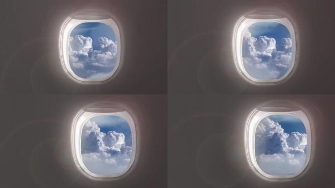 飞机窗户上有4k的蓝天视频，飞机内部有多云的鸟瞰图。