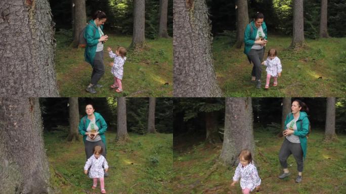带着孩子的女人旅行者，在森林里散步。