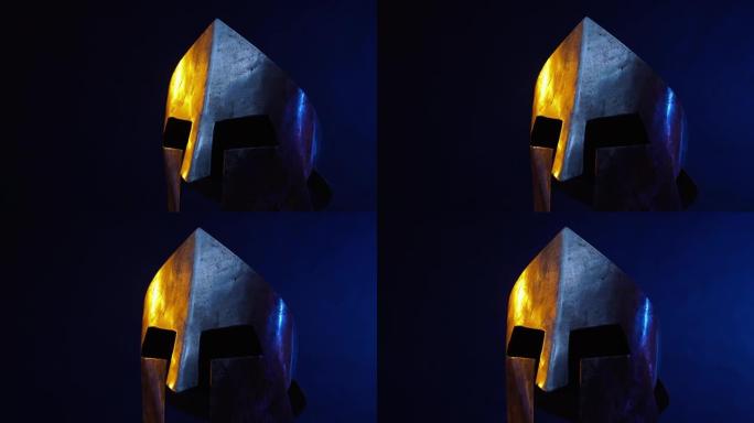 黑暗中孤立的铁制斯巴达头盔。