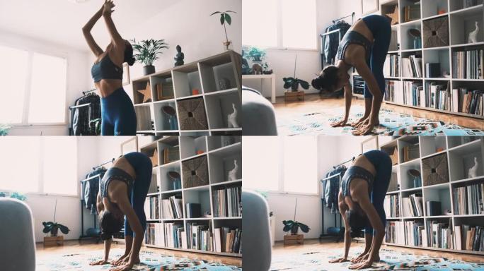 女人在家练习瑜伽，做站立向前弯曲运动