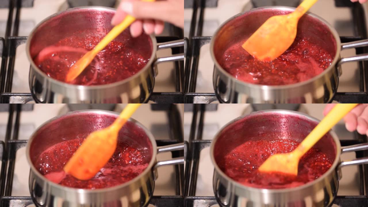 浆果酱沸腾。沸腾的红色果酱