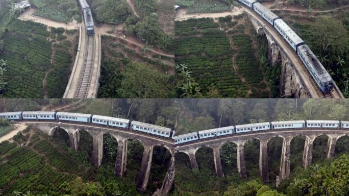 斯里兰卡埃拉丛林中著名的蓝色火车经过旧九拱桥的无人机拍摄