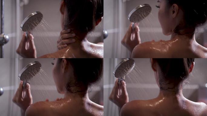 慢动作剪辑，一个用淋浴洗澡的美女。