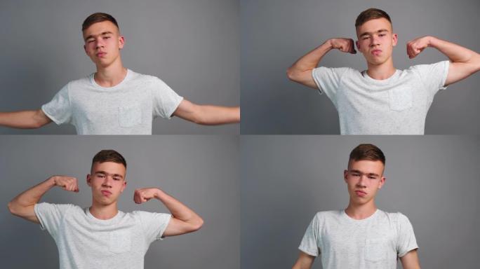 自信的运动少年男孩的肖像显示她的二头肌三头肌灰色背景提高了手臂的肌肉质量。运动员展示健身相机，乐于放