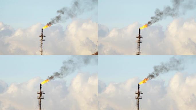 镜头B在炼油厂石油和天然气中央处理平台的火炬烟囱上起火，同时燃烧有毒物质并释放出压力。