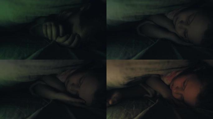 孩子失眠不安的女孩试图看睡眠
