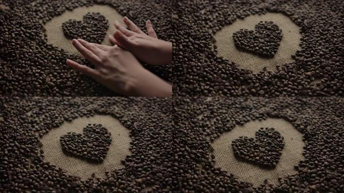 用整洁的双手精心呵护，用深色咖啡豆摆放心脏象形图