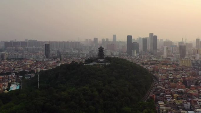 日落时间佛山市中心著名公园山顶宝塔空中俯拍全景4k中国