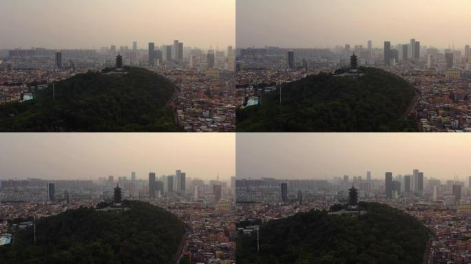 日落时间佛山市中心著名公园山顶宝塔空中俯拍全景4k中国
