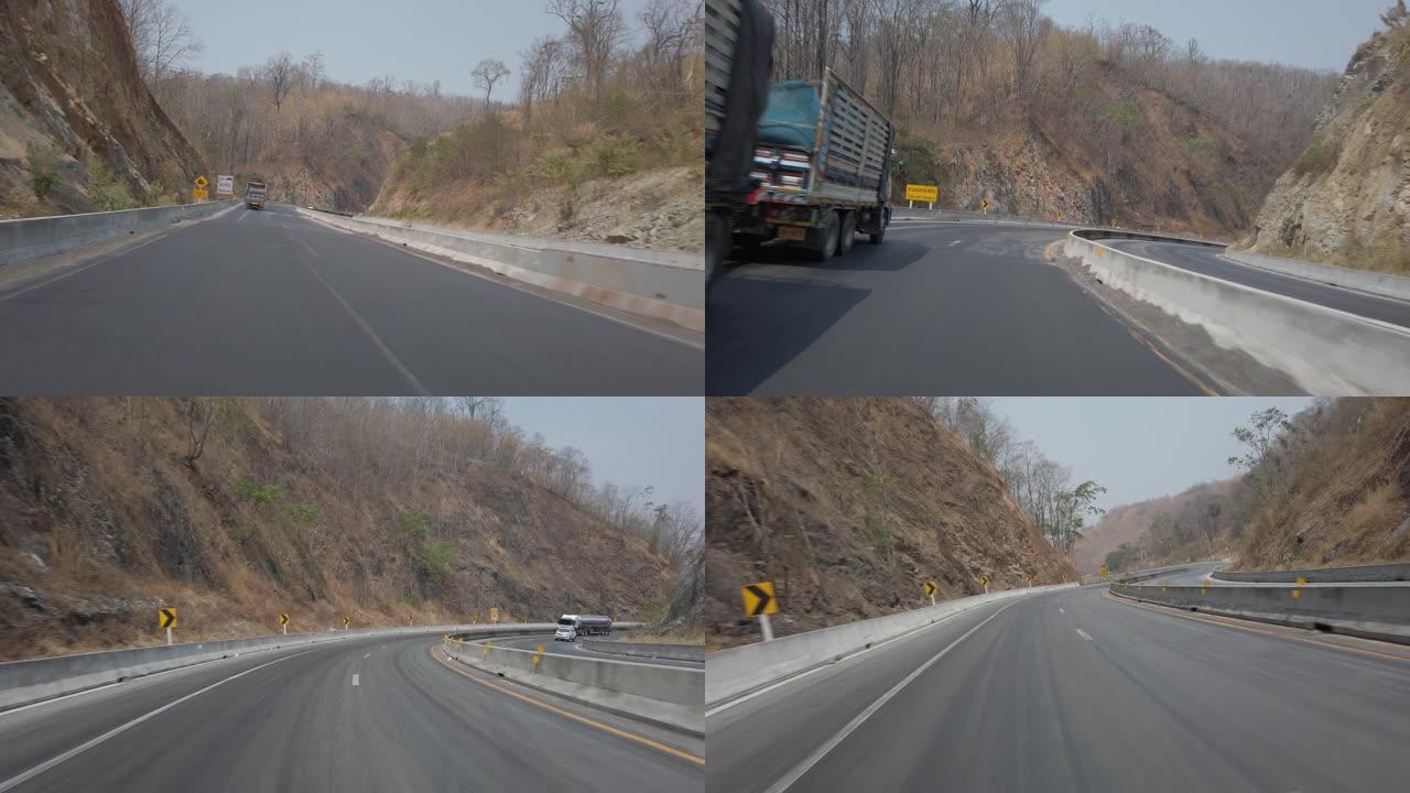 摩托车或汽车在高速上急弯下山路行驶的POV镜头。驾驶镜头4K