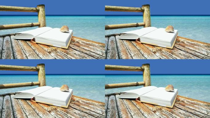 竹椅上的空白书在热带海滩上