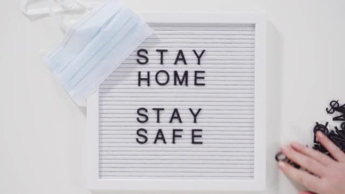 呆在家里，用蓝色医用口罩在留言板上保持安全。