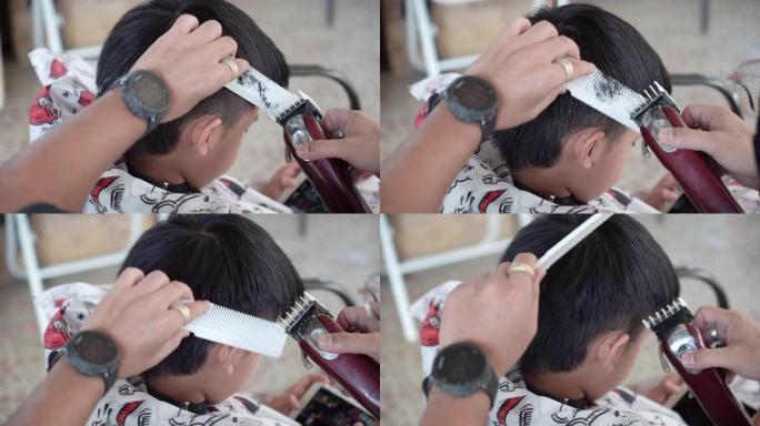 在家为男孩剪头发和修剪头发。