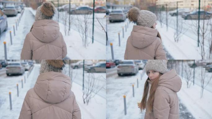 女孩走在街上，转身回望冬日