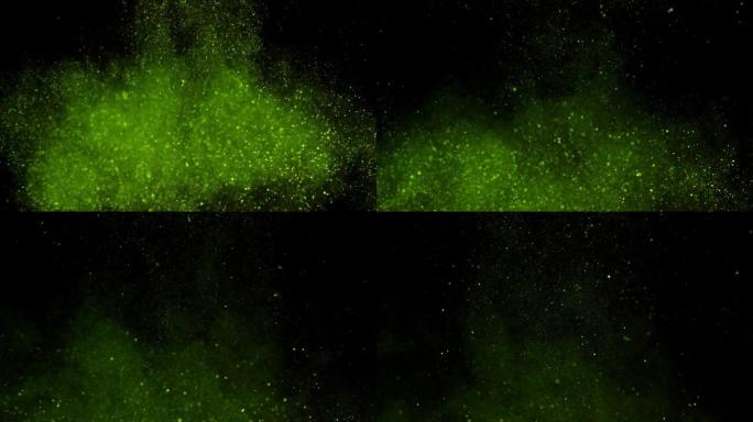 胶水-绿色的闪光掉落在水中。黑色背景。