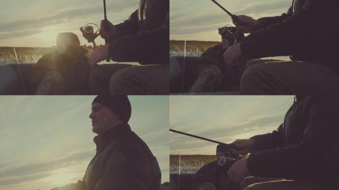 朋友钓鱼。日落时，两个朋友在平静的湖上从船上钓鱼