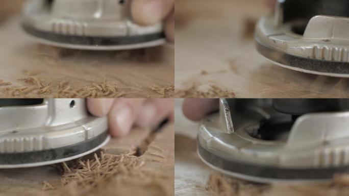 宏观。木匠使用手动电动铣刀工作。木工加工木板