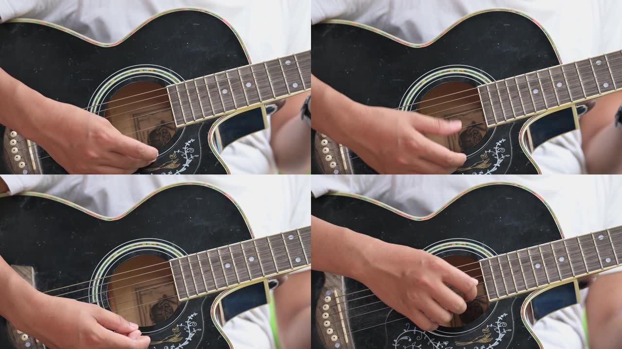 一名男性音乐家使用吉他演奏音乐。