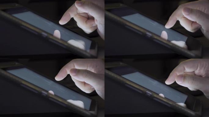 平板电脑屏幕上的4k视频特写手指触摸。
