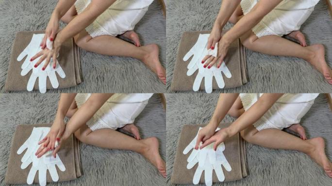 妇女在使用面膜剥离前清洁双手