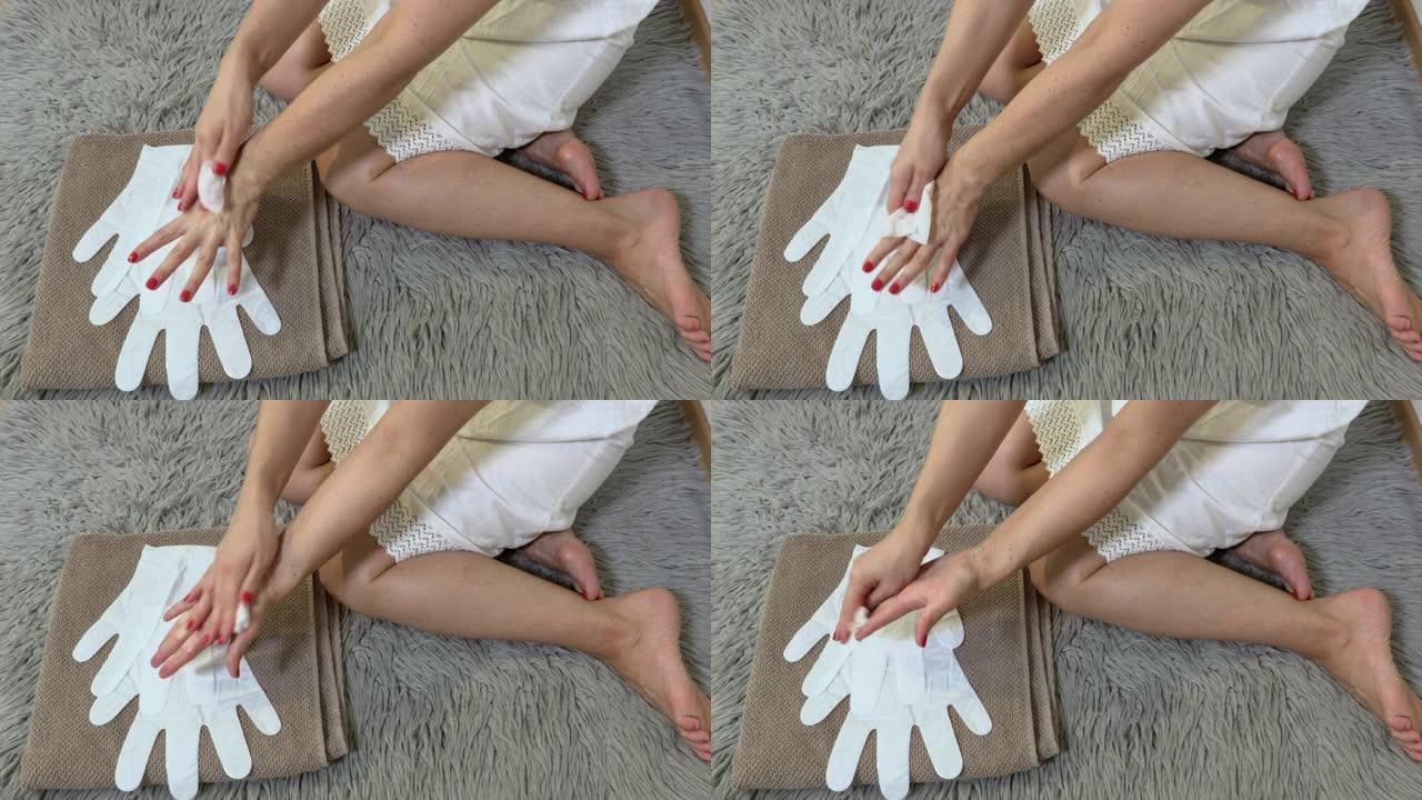 妇女在使用面膜剥离前清洁双手