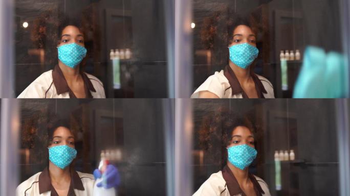 在新型冠状病毒肺炎期间，在酒店工作的4k视频女佣戴着防护口罩