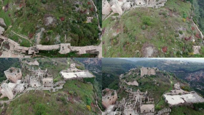 叙利亚萨拉丁城堡。叙利亚战争后一片废墟的山顶上美妙的中世纪城堡 -- 无人机的鸟瞰图