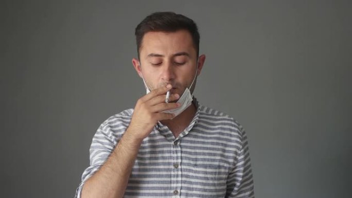 男子新型冠状病毒肺炎后用防护口罩折断香烟，戒烟