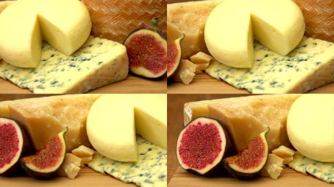 各种各样的法国奶酪放在成熟的枣果旁边的板上