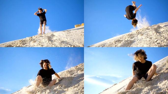 活跃的男孩从沙山跳下来，慢动作