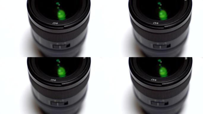 白色背景上数码相机镜头的特写。