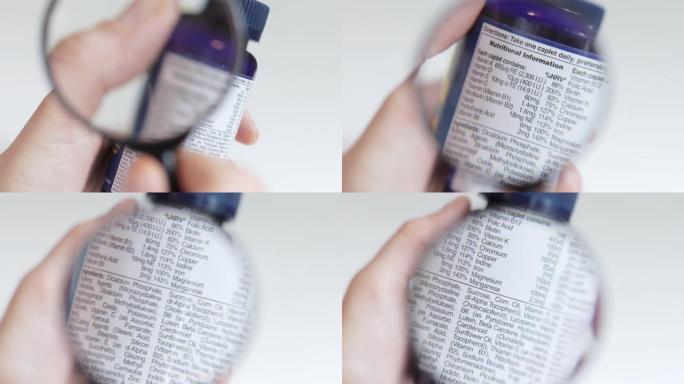 用放大镜检查一瓶补品上的营养信息标签，慢慢成为焦点