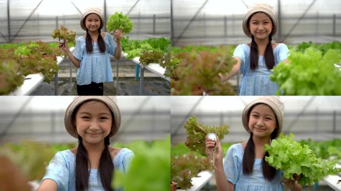 可爱的亚洲女孩在水力农场玩得开心