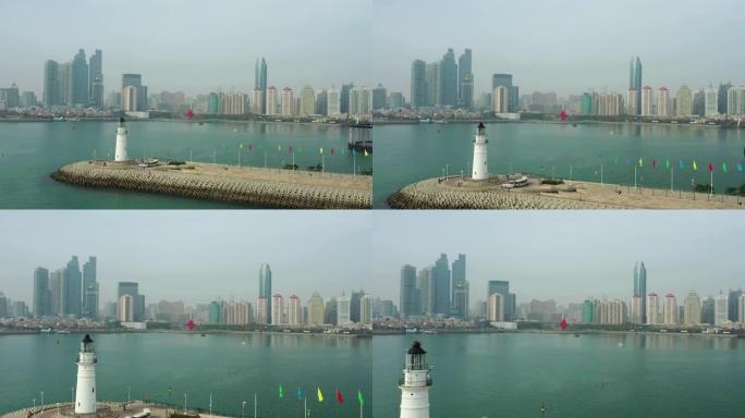 白天时间青岛市市中心海岸线湾纪念碑灯屋码头全景航空全景4k中国